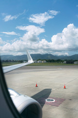 Airplane at airport with mountain range in background, Trinidad, Trinidad And Tobago