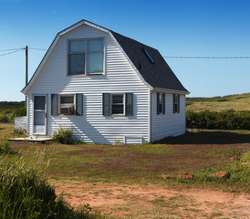 Fototapeta na wymiar Farmhouse on field, Prince Edward Island, Canada
