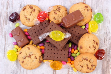 Heap of colorful candies and cookies, too many sweets
