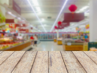 Wood floor and Supermarket blur background