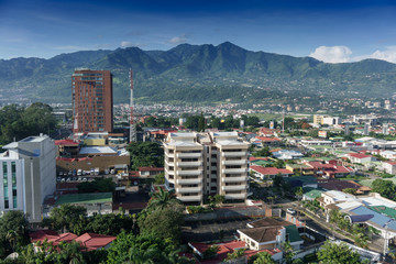 Elevated view of cityscape with mountain range in background, Costa Rica