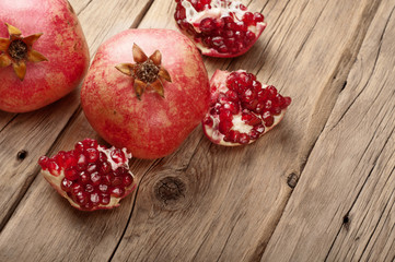 Ripe pomegranate fruit with slices of pomegranate