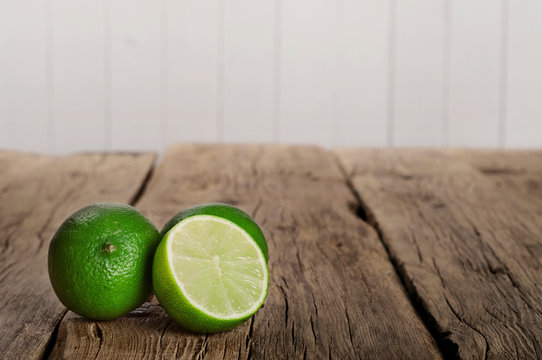 Fresh Limes On Wooden Table