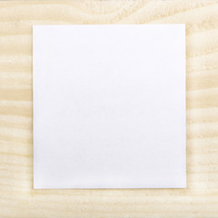 Blank paper on wood background