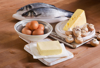 Foods containing vitamin D on a wooden table