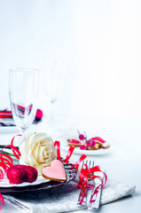 Holiday romantic table setting with pink roses
