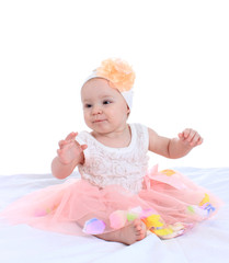 portrait of a pretty little girl in a pink dress
