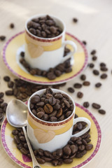 Cups with sauteed coffee beans.