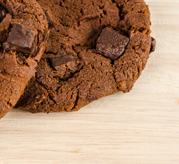 Chocolate cookies on wooden table.