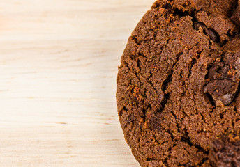 Chocolate cookie on wooden table.