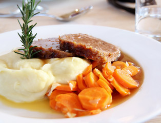 Swiss Food - minced meat steak with mashed potato and carrots