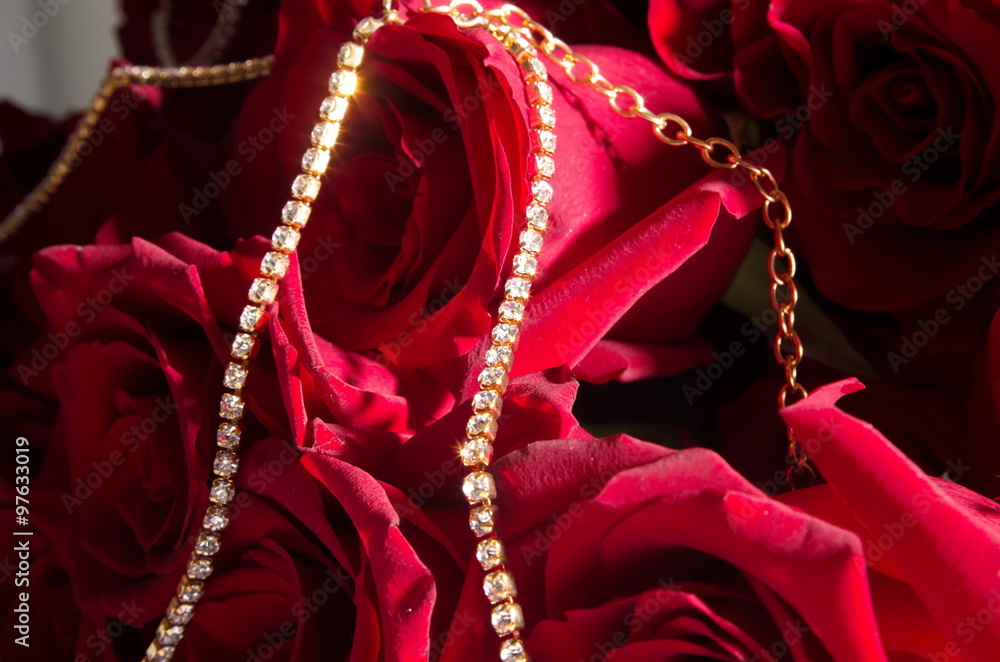 Wall mural bouquet of red roses with gold jewelry