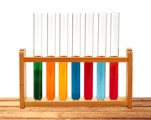 Test-tubes on wooden table isolated on white. Laboratory glasswa