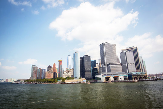 Fototapeta financial district of manhattan in new york city seen from the ferry to staten island during a sunny day
