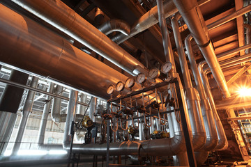 different size and shaped pipes and valves at a power plant