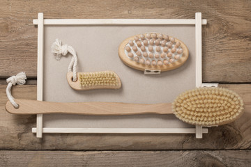 Wooden comb massagersg brushes on wooden planks