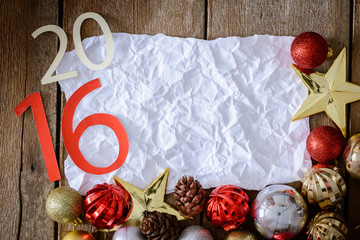 Letters 2016 and decorated Christmas tree on wooden wall