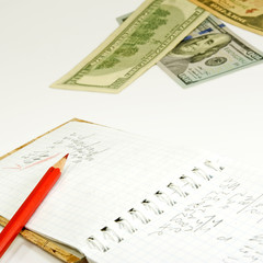  dollars, a pencil and a notebook