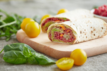 vegetarian rolls stuffed with quinoa, table beet , carrots and o