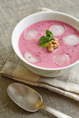 a portion of cold beet soup  on a serviette