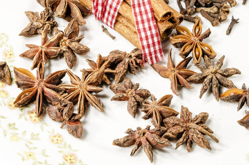 anise and cinnamon on white plate