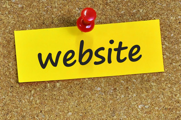 website word on yellow notepaper with cork background