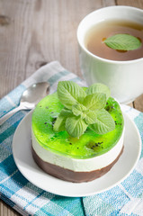 herbal tea with cake on wooden background.