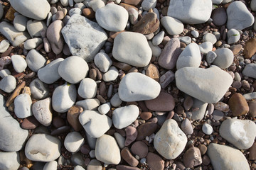 Grey pebbles stones and shingle background texture beach St Audries Bay Somerset uk