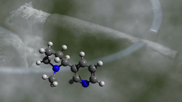 nicotine molecule rotating with glimmering cigar in background