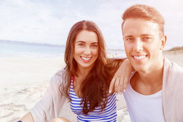 Fototapeta na wymiar Romantic young couple on the beach
