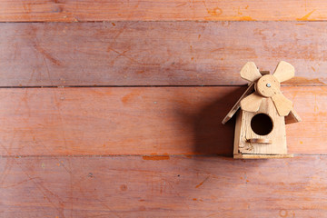 bird house on wooden panel