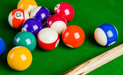 Billiard balls on green table with billiard cue, Snooker.