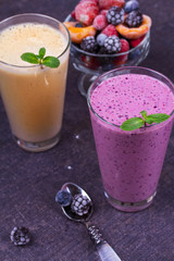 Frozen summer berries and banana milkshake garnished with mint