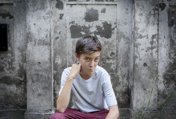 portrait of a crouching teenage boy