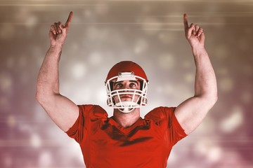 Composite image of american football player cheering