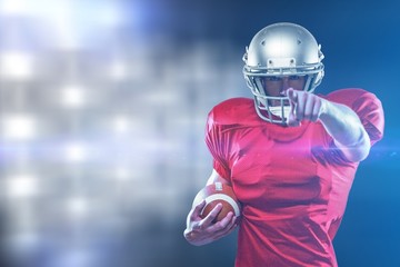 Composite image of portrait sports player in red jersey pointing