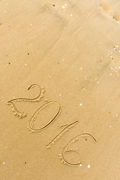 2016 Year written on the beach sand