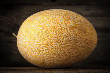 Ripe melon on the wooden table