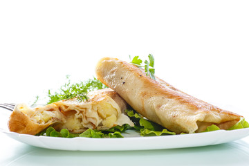 fried stuffed spring rolls on a plate