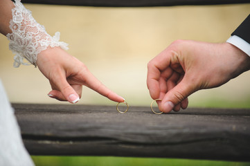 Newlyweds Palying with Rings