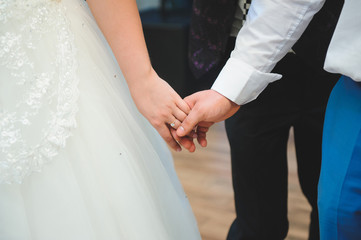 Obraz na płótnie Canvas Holding Hands at Wedding