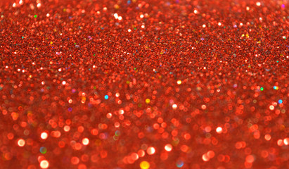 Blurry background of red glitter sparkles