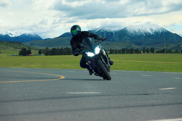 young man riding big bike motorcycle on asphalt highways use for