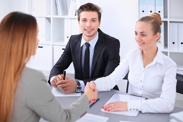 Business people shaking hands, finishing up a meeting