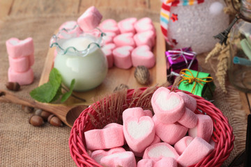 Fototapeta na wymiar Heart pink marshmallow sweet with yogurt delicious.