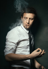 Elegant young man smoking
