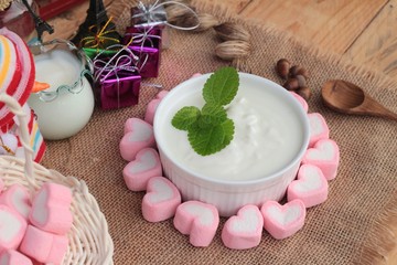 Heart pink marshmallow sweet with yogurt delicious.