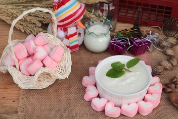 Heart pink marshmallow sweet with yogurt delicious.