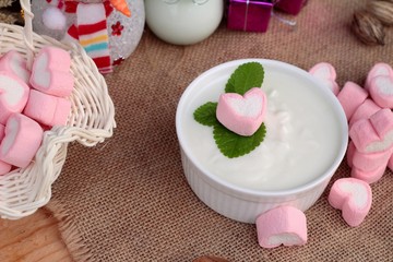 Heart pink marshmallow sweet with yogurt delicious.