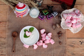 Heart pink marshmallow sweet with yogurt delicious.